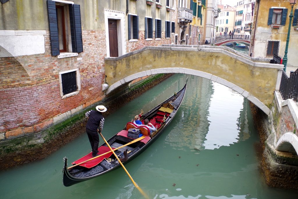 A gondola through Venice is one of the best ideas from the bucket list for couples. 