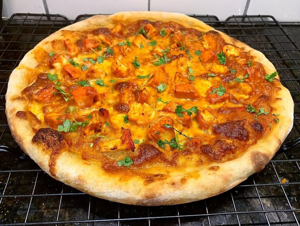 A chicken tikka masala pizza tops our list of weirdest pizza toppings and combinations.