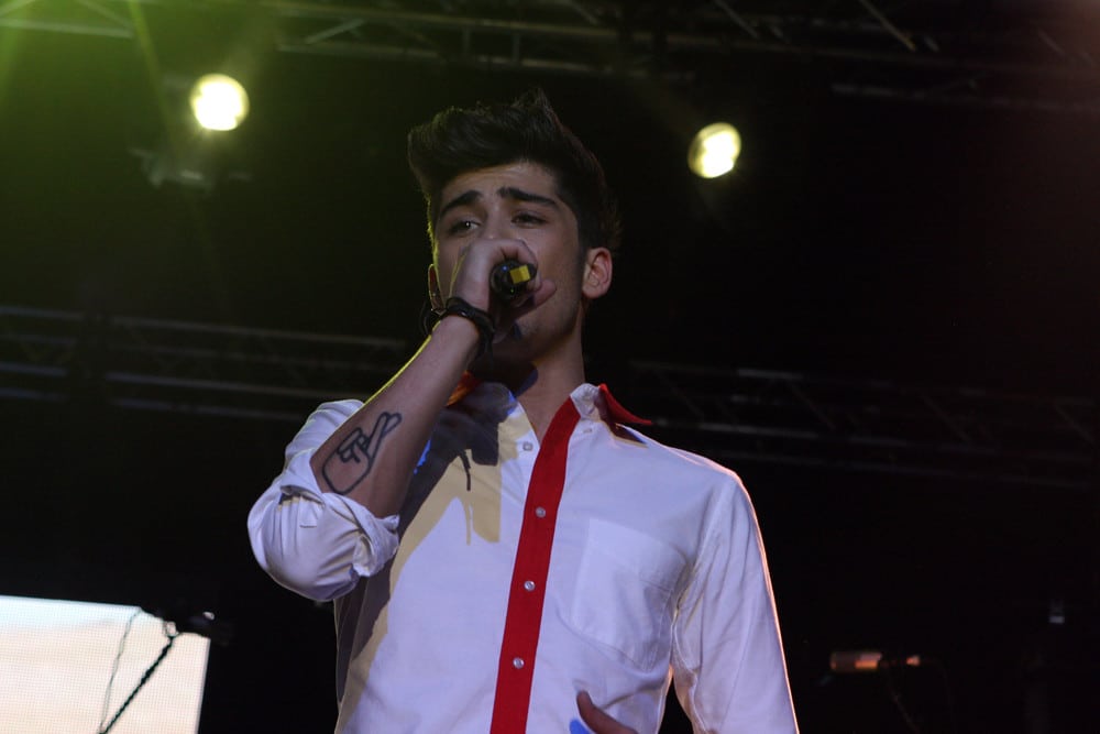 Zayn Malik performing on stage.