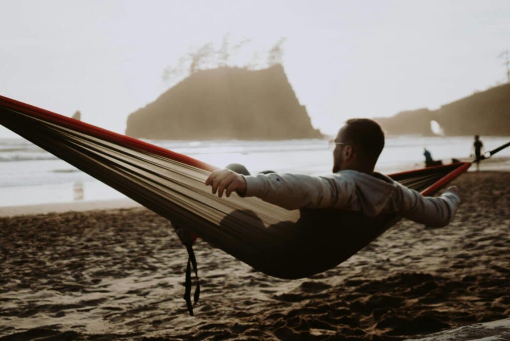 Picture of a man relaxing while on a solo trip.