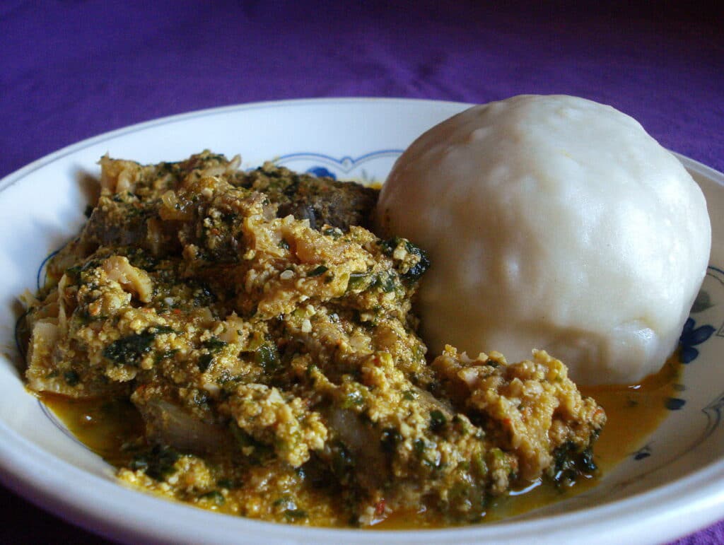 A bowl of edusi soup and pounded yam. Tuwo shinfaka is one of the national foods of Nigeria.