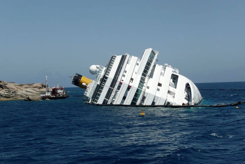 Picture of a cruise ship drowning in an ocean.