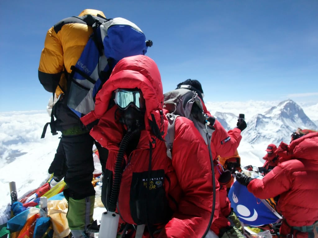 Picture of a crowd of people climbing Mount Everest.