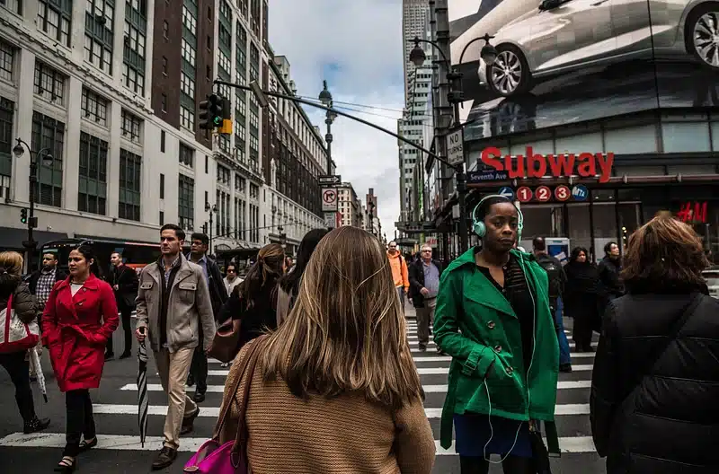 Picture of a crowd of people walking around. Used to explain why I gave up my career to travel the world and why it’s worth it.